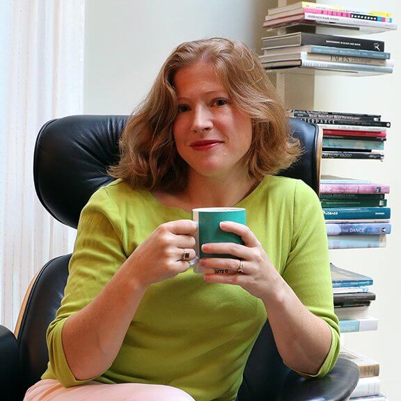 Cynthia Portrait sitting with coffee mug