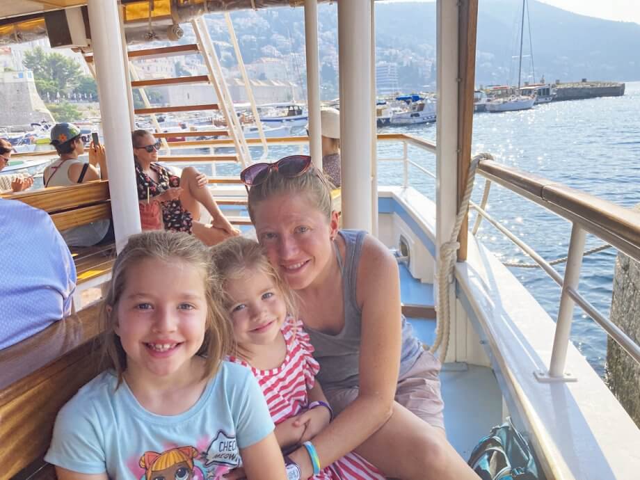 mom and two kids on the ferry to Lokrum island from Dubrovnik, Croatia
