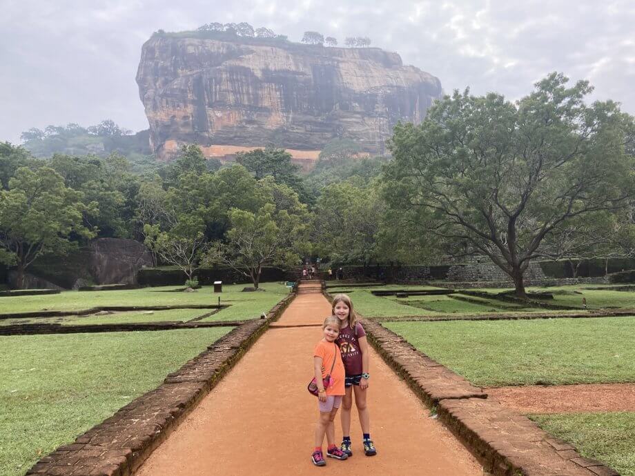 Two kids on the path leading to the imposing Lion Rock in Sigiriya Sri Lanka