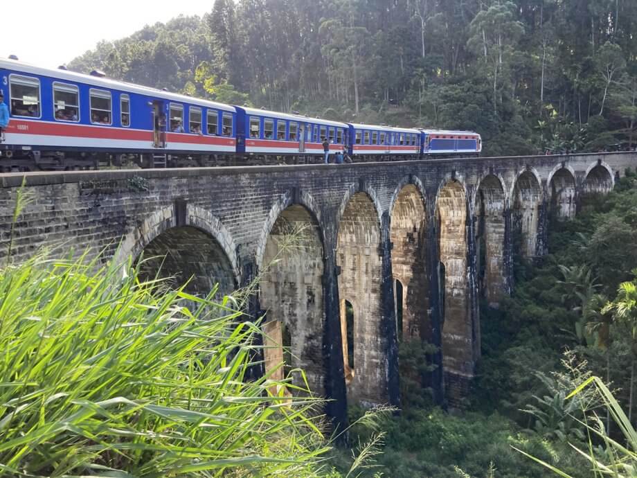 Train crossing the Nine Arches Bridge outside Ella Sri Lanka