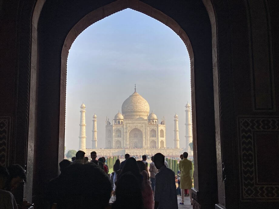 Taj Mahal as seem over the crowds from the first gate