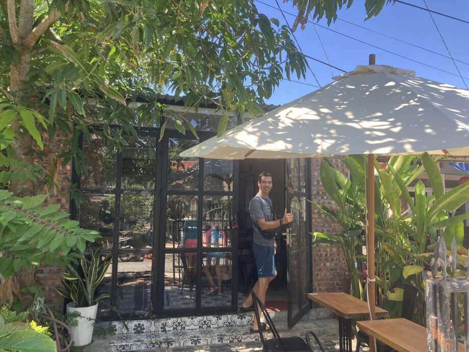 W at the door of Thom's Bakery in An Bang Vietnam